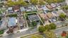Aerial perspective of suburban area featuring property boundaries highlighted