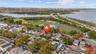 Aerial view of property's location with a notable bridge, nearby suburban area, and a nearby body of water