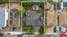 Aerial view of residential area featuring property parcel outlined