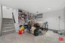Carpeted home office featuring a textured ceiling and baseboards