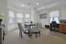 Conference room featuring light colored carpet, a desk, and recessed lighting