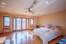 Bedroom with access to outside, radiator heating unit, recessed lighting, wood finished floors, and ceiling fan