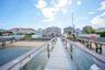 Dock area featuring a residential view and a water view