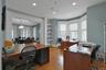 Office space featuring french doors, light wood-style flooring, healthy amount of natural light, and recessed lighting