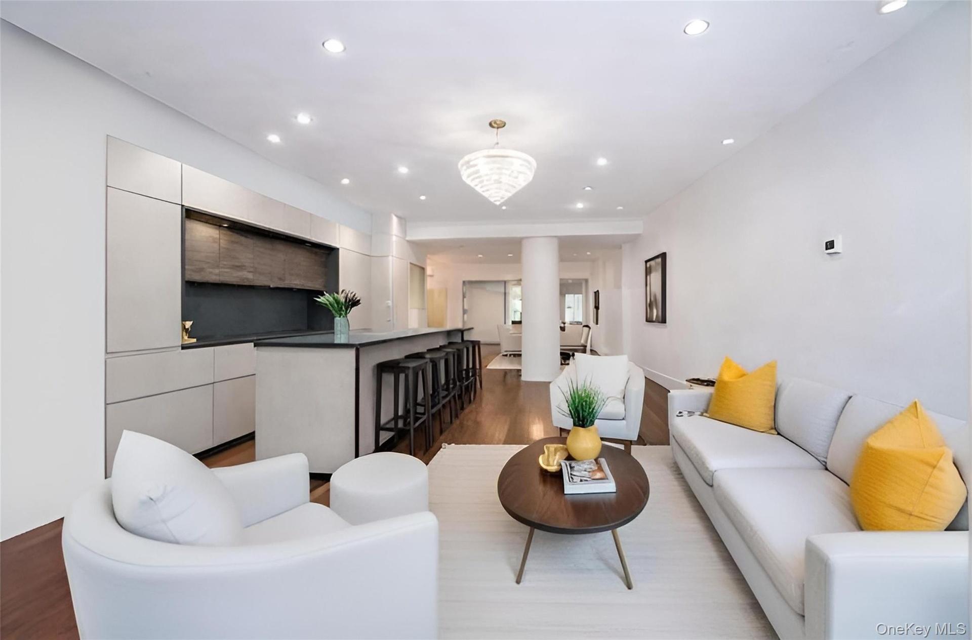 Expansive living, dining, and kitchen entertaining space.