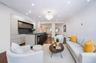Expansive living, dining, and kitchen entertaining space.