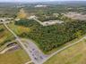 Aerial overview of property's location featuring a forest