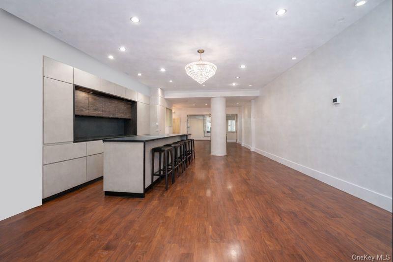 Expansive living, dining, and kitchen entertaining space.
