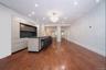 Expansive living, dining, and kitchen entertaining space.