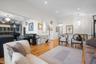 Living room with an inviting chandelier and light wood-type flooring