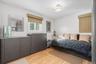 Bedroom with hardwood / wood-style floors