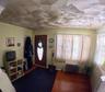 Entrance foyer featuring radiator heating unit and wood-type flooring