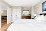 Bedroom featuring light wood finished floors and a closet