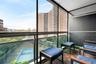 Balcony with a view of city and a sunroom