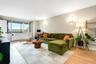 Living area with light wood-style floors and baseboards