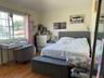 Bedroom with wood finished floors