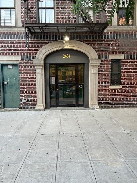 Property entrance with brick siding