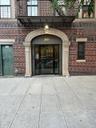 Property entrance with brick siding