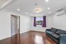 Unfurnished room featuring dark wood-type flooring, ornamental molding, a wall mounted air conditioner, and recessed lighting