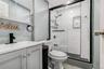 Bathroom with vanity and a shower stall