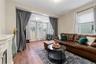 Living area featuring plenty of natural light, wood finished floors, and a fireplace