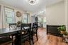 Dining space with light wood-style floors, open concept