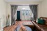 Living area with wood finished floors and baseboards