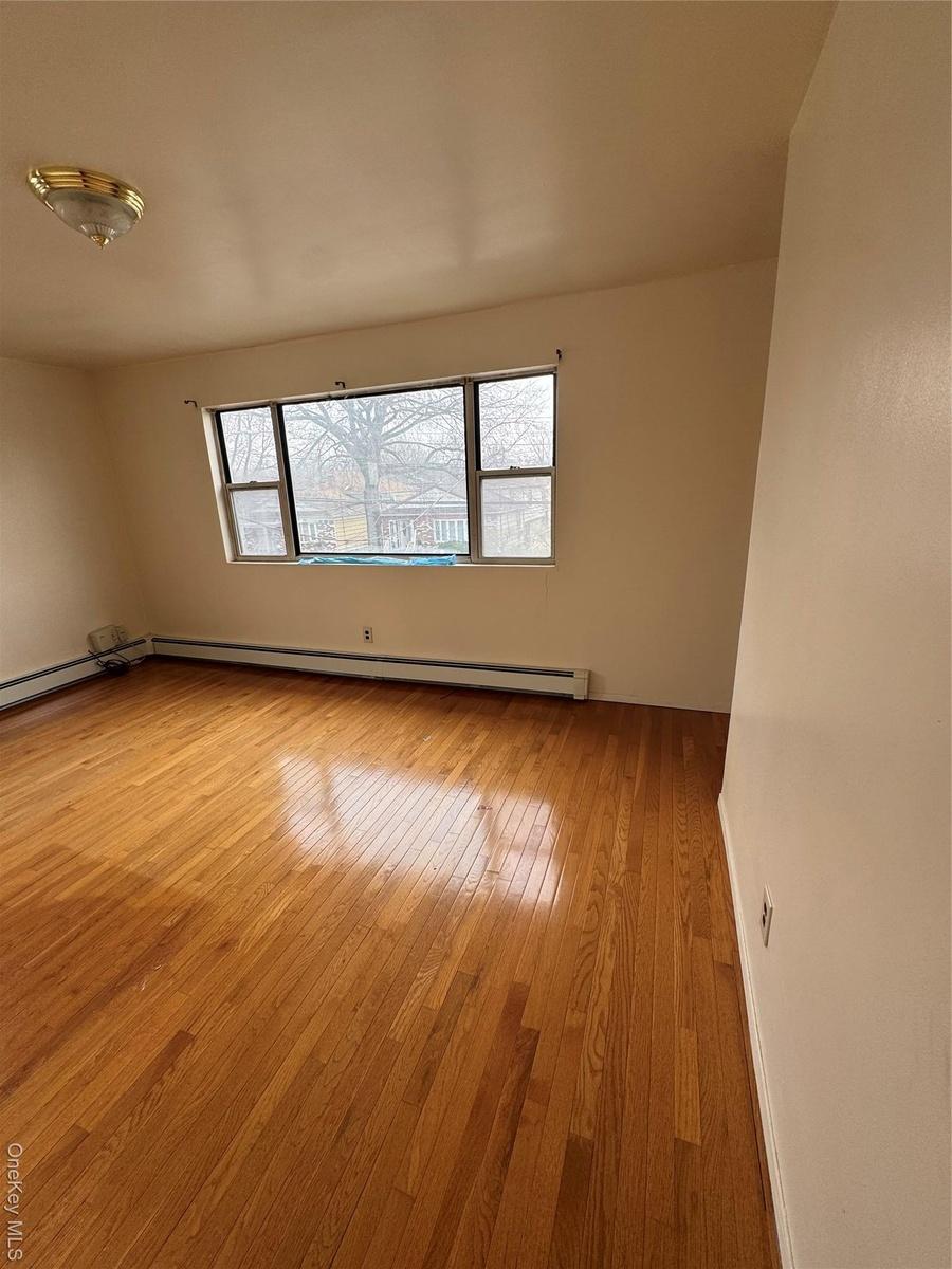 Empty room featuring light wood-type flooring