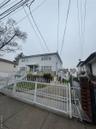 View of front of house featuring a gate and a fenced front yard
