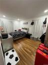 Bedroom with wood finished floors and recessed lighting