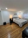 Bedroom featuring wood-type flooring and recessed lighting
