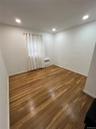 Spare room featuring hardwood / wood-style flooring and recessed lighting