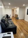 Living room with wood finished floors and recessed lighting