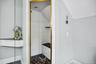 The primary bath offers a true spa retreat, complete with a whirlpool jetted tub, soft recessed lighting, double vanity, and an e-steam shower designe
