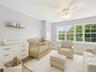 Versatile bedroom on the upper level, currently styled as an nursery.