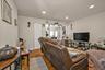 Living area featuring wood finished floors and recessed lighting