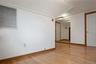 Spare room with light wood-type flooring, baseboards, and visible vents