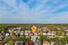 Drone / aerial view with a forest view and a residential view