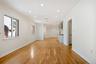 Unfurnished living room featuring recessed lighting, visible vents, ornamental molding, light wood-type flooring, and baseboards