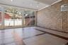 Unfurnished sunroom with visible vents, a wall mounted air conditioner, and beamed ceiling