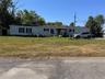 Manufactured / mobile home with a front lawn