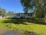 View of front of home featuring a front lawn