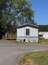 View of property exterior with an outbuilding