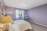 Carpeted bedroom with baseboards