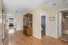 Corridor featuring light wood-style flooring