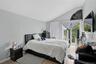 Bedroom with access to exterior and vaulted ceiling