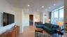 Living area featuring light wood-style flooring, recessed lighting, expansive windows, and crown molding