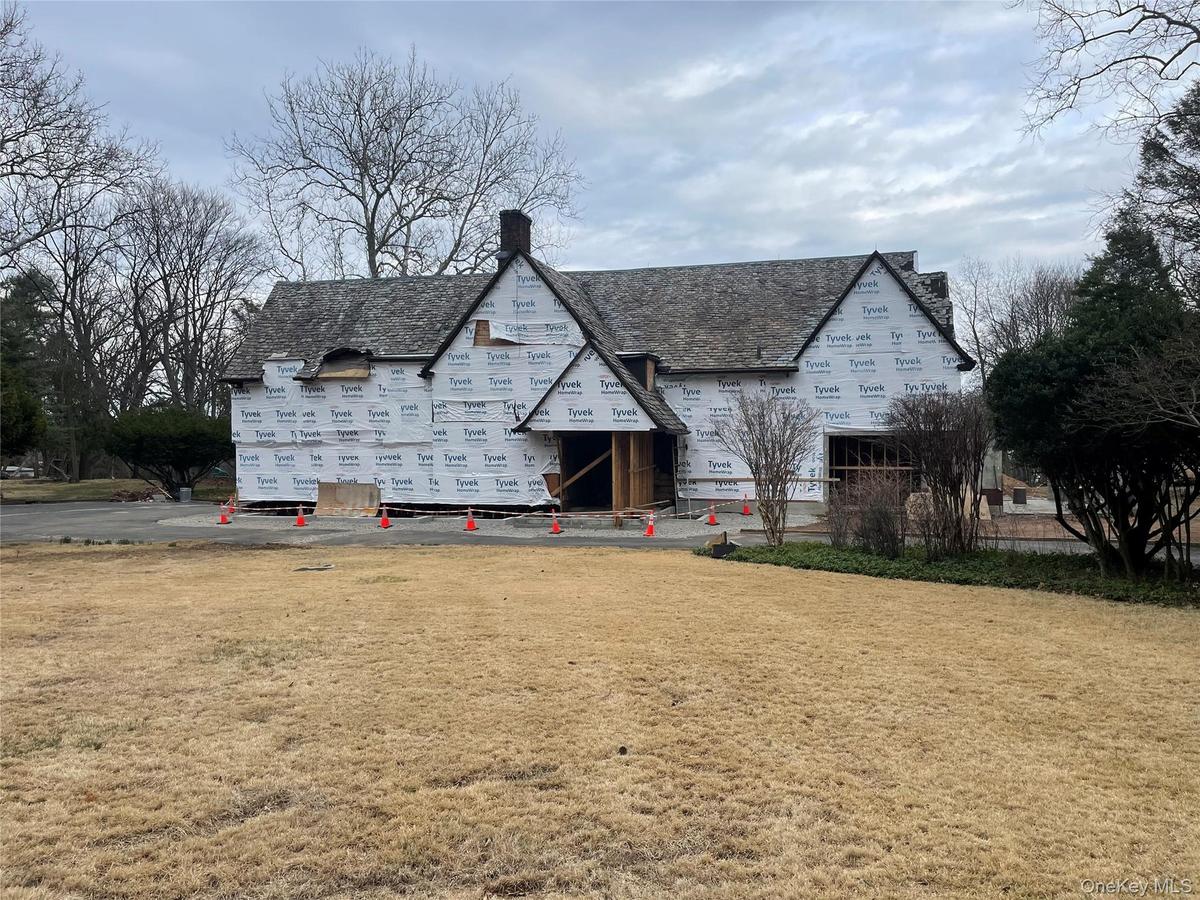 Property in mid-construction featuring a chimney