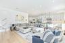 Living area featuring stairway, light wood finished floors, recessed lighting, and crown molding