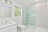 Bathroom featuring vanity and a walk in shower